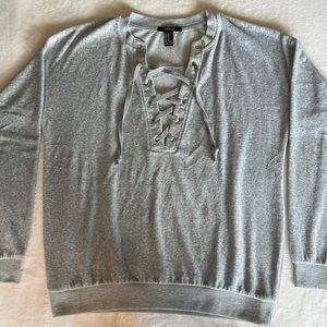 Grey sweater tie up detail.